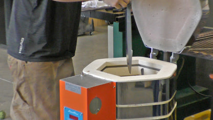 Jen-Ken Kilns man loading a Vertical Air Bath knife kiln