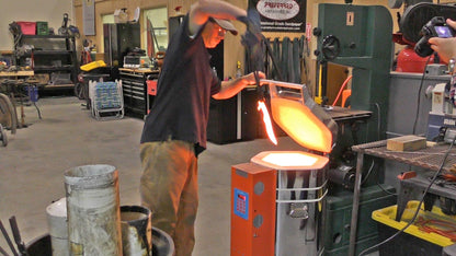 Jen-Ken Kilns man unloading a Vertical Air Bath knife kiln with glowing blade